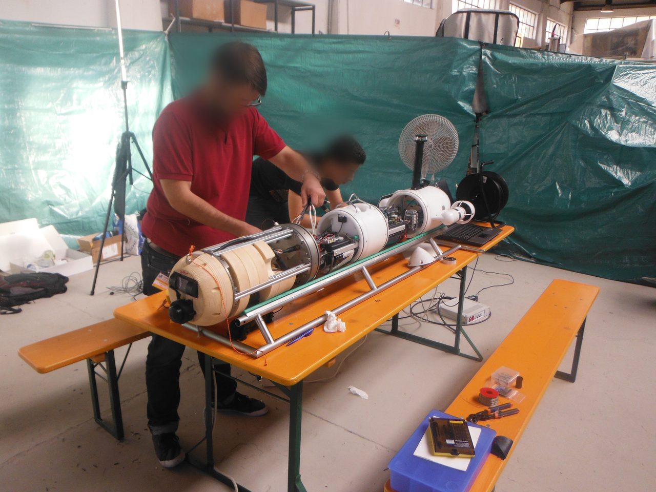 SPARUS II workshop assembly with exposed electronics and sensor modules.